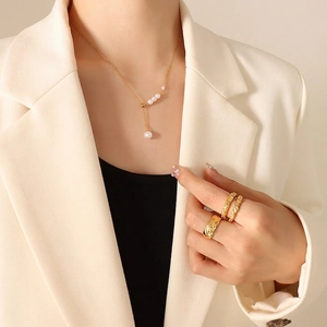 French vintage style pearl necklace with gold quilted ring and twisted stackable rings
