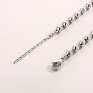 Macro shot of silver stainless steel ball chain with adjustable lobster clasp and extender