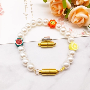 Fruit pearl bracelet for children featuring golden magnetic clasp and colorful beads