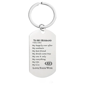 Detail of silver stainless steel dog tag keychain with engraved romantic quote for husband