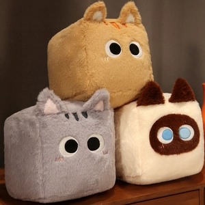 Close-up of soft long-pile faux fur texture on three square cat plush pillows