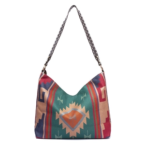 Close-up of bohemian tribal pattern fabric with brown faux leather stitched strap handle