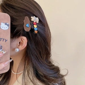 Detail of flocking bear and wave hair clips worn on long brown hair, cute 2-piece set