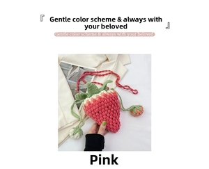 Detailed view of handmade strawberry knit bucket bag with pink strap and pompom tassel