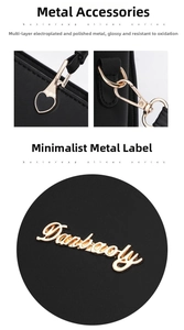Close-up of golden heart-shaped zipper and metal Danbaoly brand hardware on black bag