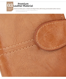 Close-up of brown textured leather wallet featuring neat beige stitching and a metal loop
