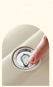 Detail of manual date tracker dial on cream egg storage box with chrome finish