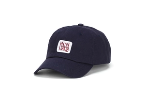 Detail of navy baseball cap with white Maria patch and red embroidery stitching