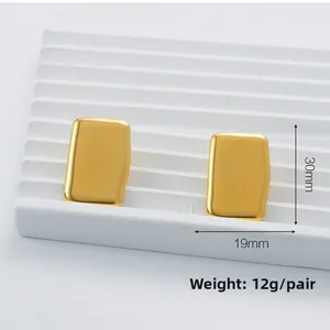 Detailed view of gold rectangle stud earrings with 30mm height and 19mm width size specs