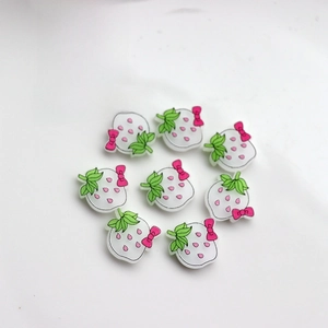 Macro view of 8 strawberry resin charms for DIY crafts and phone case decoration