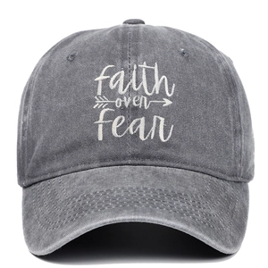 Faded charcoal cotton baseball cap with Faith Over Fear embroidery in a front view