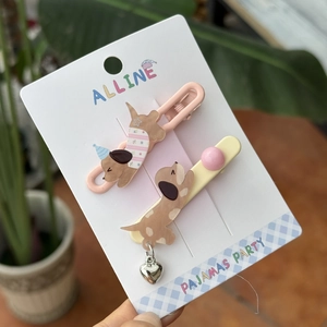 Sweet pink and yellow acrylic dog hair clips set on display card with heart pendant