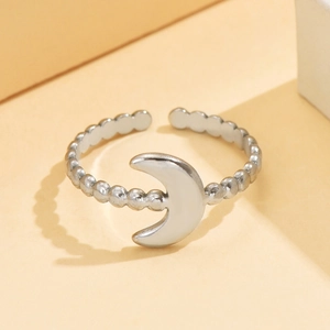 Adjustable silver crescent moon ring with beaded band and metallic finish in a 45-degree view