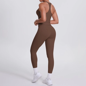 Detail of dark brown racerback sports bra and high-waisted yoga leggings with side seams