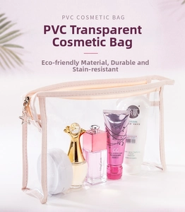 Close-up of clear PVC cosmetic bag with pink trim and a star-shaped metal zipper pull