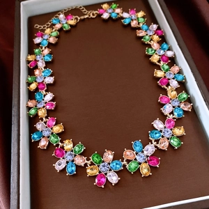 Detailed shot of multi-color crystal flower necklace in a jewelry display box