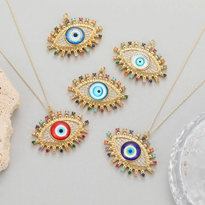 Colorful evil eye charms in gold with enamel detail and sparkling zircon gemstones