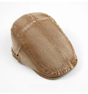 Detailed top view of vintage washed cotton flat cap with distressed texture and stitching