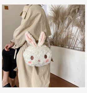 Detailed view of white plush bunny bag with elegant pearl chain strap for Lolita fashion