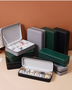 Stack of 6 and 10 slot leather watch display boxes showing gray pillows and plush interior