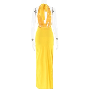 Detail view showing backless halter design and tie-up ribbon of this long yellow dress