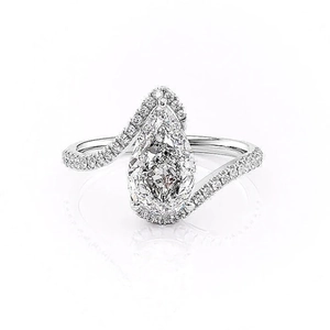 Luxury pear-shaped engagement ring with halo diamonds and twisted pavé-set band