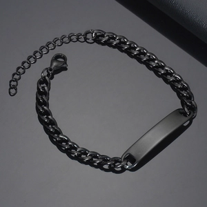 Black stainless steel Cuban chain bracelet with a polished ID bar and adjustable clasp