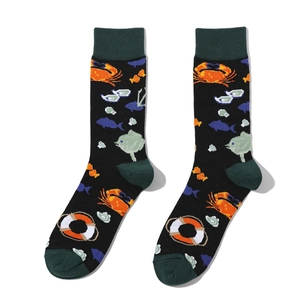 Detailed knit pattern of cotton mid-calf socks with crab and fish nautical patterns