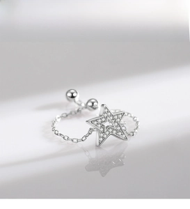 Close-up of S925 silver star ring with micro-pave zircons and adjustable chain details