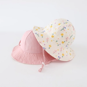 Close-up of kids reversible sun hat with floral pattern and adjustable chin strap