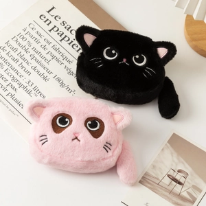 Detail shot of cute plush cat pouches in black and pink with fine facial embroidery