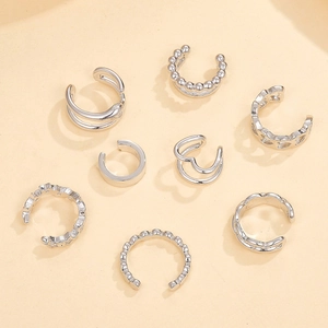 Detailed set of eight S925 silver geometric clip-on earrings with polished metal textures