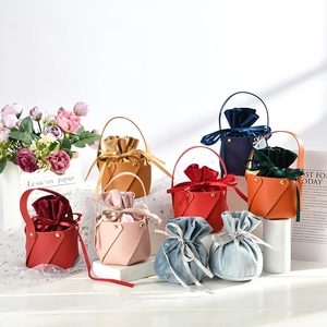 Close-up of premium PU leather candy bags with velvet lining and elegant ribbon bows
