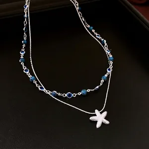 Collier double rang avec pendentif étoile de mer et perles bleues scintillantes pour femme
