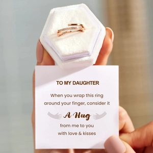 Detailed view of rose gold layered ring with zircon pavé, gift box, and daughter card