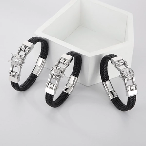 Braided leather bracelets for men featuring silver wolf, skull, and lion head charms