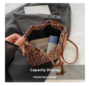 Top view of spacious leopard print bucket bag interior showing large storage capacity