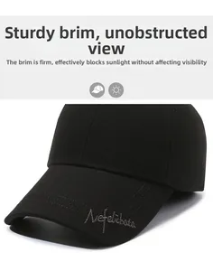 Detail of the firm brim and Nefelibata embroidery on this black wool baseball cap
