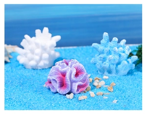 Detailed view of colorful artificial coral decor for aquariums on blue sand bed