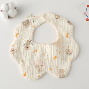Close-up of muslin cotton baby bib with cute koala print and soft petal edge design