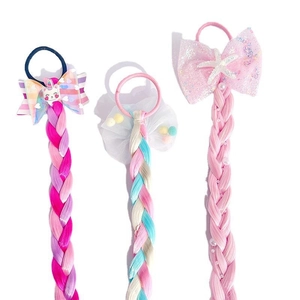 Girl's rainbow hair extensions with unicorn bows and cute colorful braided pigtails