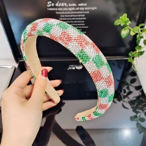 Detailed view of colorful rhinestone headband with red and green checkered crystal patterns