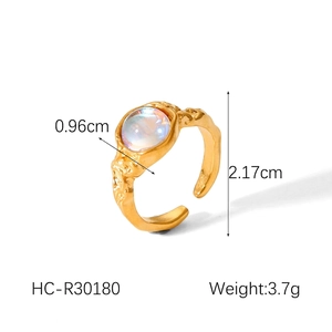 Detail shot showing 0.96cm moonstone on irregular lava texture gold stainless steel ring