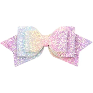 Close-up of a 5-inch glitter bow hair clip with pink, purple, and gold gradient shine