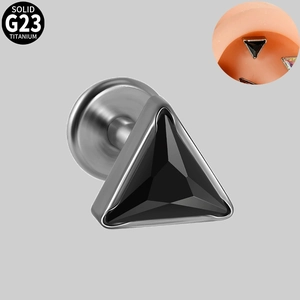 Macro shot of G23 titanium internall threaded labret stud with black triangle zircon