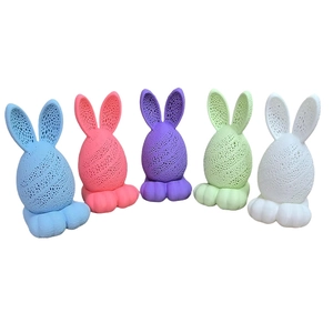Detail of five 3D printed LED Easter bunny egg lamps in assorted vibrant colors