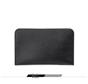 Detail view of the back side of a large capacity black leather clutch bag for women