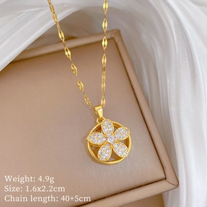 Close-up of a gold rotating flower pendant with sparkling crystals and size specifications