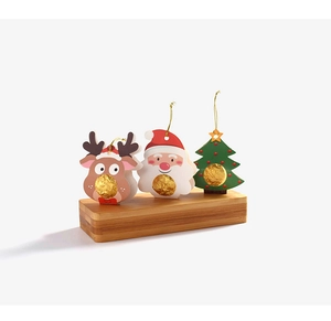 Detail showing Santa and Reindeer cardboard candy wrappers for Christmas decorations