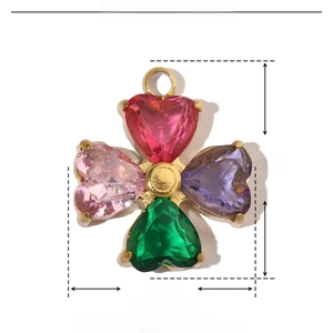 Detail view of golden clover pendant with zircon heart stones and dimensions 14mm by 12mm